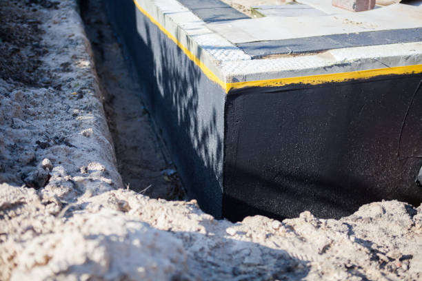 Professional Basement Waterproofing technician working in Lewiston, NY